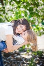 Mother hugs daughter