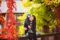 Mother hugs her son in the autumn park Royalty Free Stock Photo