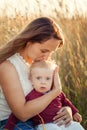Mother hugs and kisses his little son in summer sunny day. Concept of happiness and tenderness Royalty Free Stock Photo