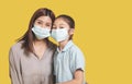 Mother hugs little daughter in protective medical masks during Covid-19 pandemics