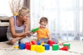 Mother and kid boy playing together indoor Royalty Free Stock Photo