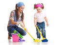 Mother with kid cleaning room and having fun