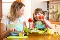 Mother and kid cooking and having fun in kitchen Royalty Free Stock Photo