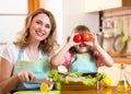 Mother and kid cooking and having fun in kitchen Royalty Free Stock Photo