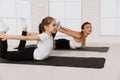 Mother and kid daughter in the gym centre doing stretching fitness Yoga exercise Royalty Free Stock Photo