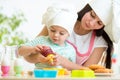 Mother and kid girl making cookies Royalty Free Stock Photo