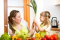 Mother and kid have fun preparing healthy food Royalty Free Stock Photo