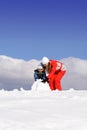 Mother with kid making snowman