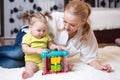 Mother and kid playing block toys at home Royalty Free Stock Photo