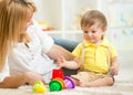 Mother and kid playing block toys at home Royalty Free Stock Photo