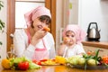 Mother and kid preparing healthy food and having fun Royalty Free Stock Photo