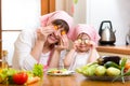 Mother and kid preparing healthy food and having fun Royalty Free Stock Photo