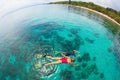 Mother, kid in snorkeling mask dive underwater with tropical fishes Royalty Free Stock Photo