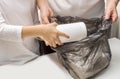 Mother and kid sorting garbage. Waste separate collection and recycling. Female and child hands fold up empty plastic bottles into Royalty Free Stock Photo