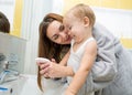 Mother and kid washing hands with soap together Royalty Free Stock Photo