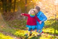 Mother and kids in autumn park. Family in rain Royalty Free Stock Photo