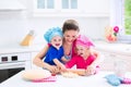 Mother and kids baking a pie