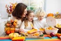 Family cooking pumpkin soup for Halloween lunch