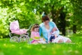 Mother and kids enjoying picnic outdoors
