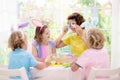 Mother and kids  family coloring Easter eggs Royalty Free Stock Photo