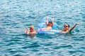 Mother and kids have fun swimming in sea in Marmaris