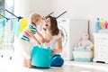 Family in laundry room with washing machine Royalty Free Stock Photo