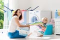 Family in laundry room with washing machine Royalty Free Stock Photo