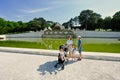 Mother with kids near fountain at Schonbrunn Palace in Vienna, Austria