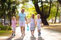 Mother and kids in sunny summer park