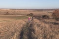 Mother and kids on their bikes go up the hill