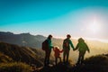 Mother with kids travel in mountains, family hiking in nature Royalty Free Stock Photo