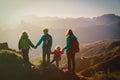 Mother with kids travel in mountains, family hiking in nature Royalty Free Stock Photo