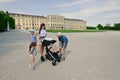 Mother with kids walk in Schonbrunn Palace in Vienna, Austria