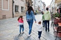 Mother with kids walking at street of Bratislava, Slovakia Royalty Free Stock Photo