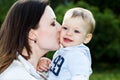 Mother kiss baby boy Royalty Free Stock Photo