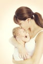 Mother Kiss Newborn Baby, Mom holding and Kissing New Born Kid Royalty Free Stock Photo