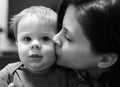 Mother kissing a baby boy Royalty Free Stock Photo