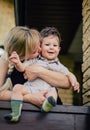 Mother kissing baby outdoors Royalty Free Stock Photo