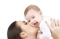 Mother kissing her baby Royalty Free Stock Photo