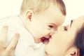 Mother kissing her baby Royalty Free Stock Photo