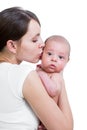 Mother kissing her infant baby boy isolated Royalty Free Stock Photo