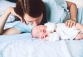 Mother kissing her newborn baby. Royalty Free Stock Photo