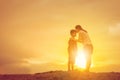 Mother kissing his son in a forehead on the sunset summer day Royalty Free Stock Photo