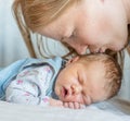 Mother kissing newborn baby Royalty Free Stock Photo