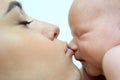 Mother kissing newborn baby in the nose Royalty Free Stock Photo