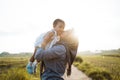 A mother kissing when raising her daughter when standing the road Royalty Free Stock Photo