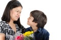 Mother kissong her son with flower Royalty Free Stock Photo