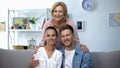 Mother-in-law embracing son and his wife, happy family relationship concept Royalty Free Stock Photo