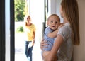 Mother leaving her baby with teen nanny at home