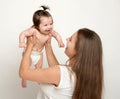 Mother lift up baby, play and having fun Royalty Free Stock Photo